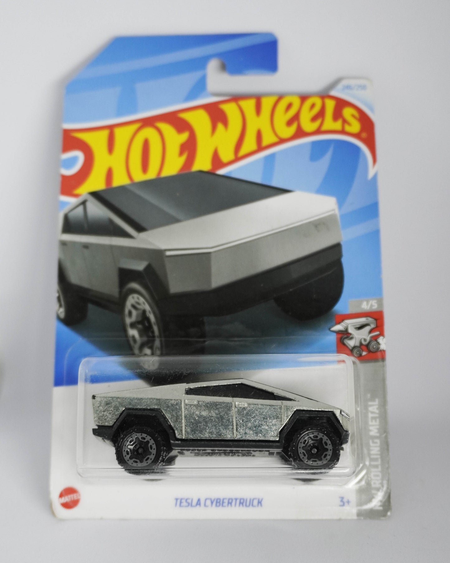Hot Wheels Tesla Cybertruck toy car in packaging on a gray background