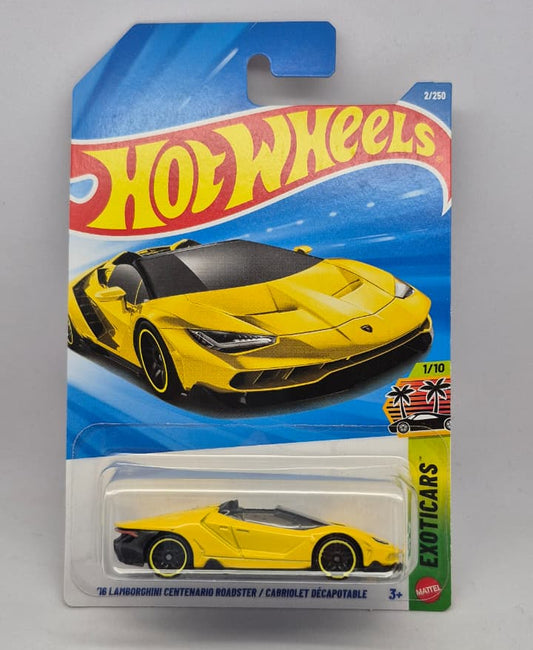 Yellow toy car in Hot Wheels packaging on a gray background
