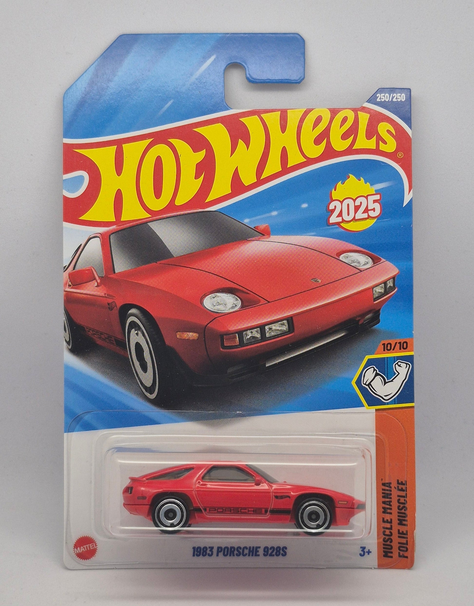 Red Hot Wheels toy car in packaging on a gray background