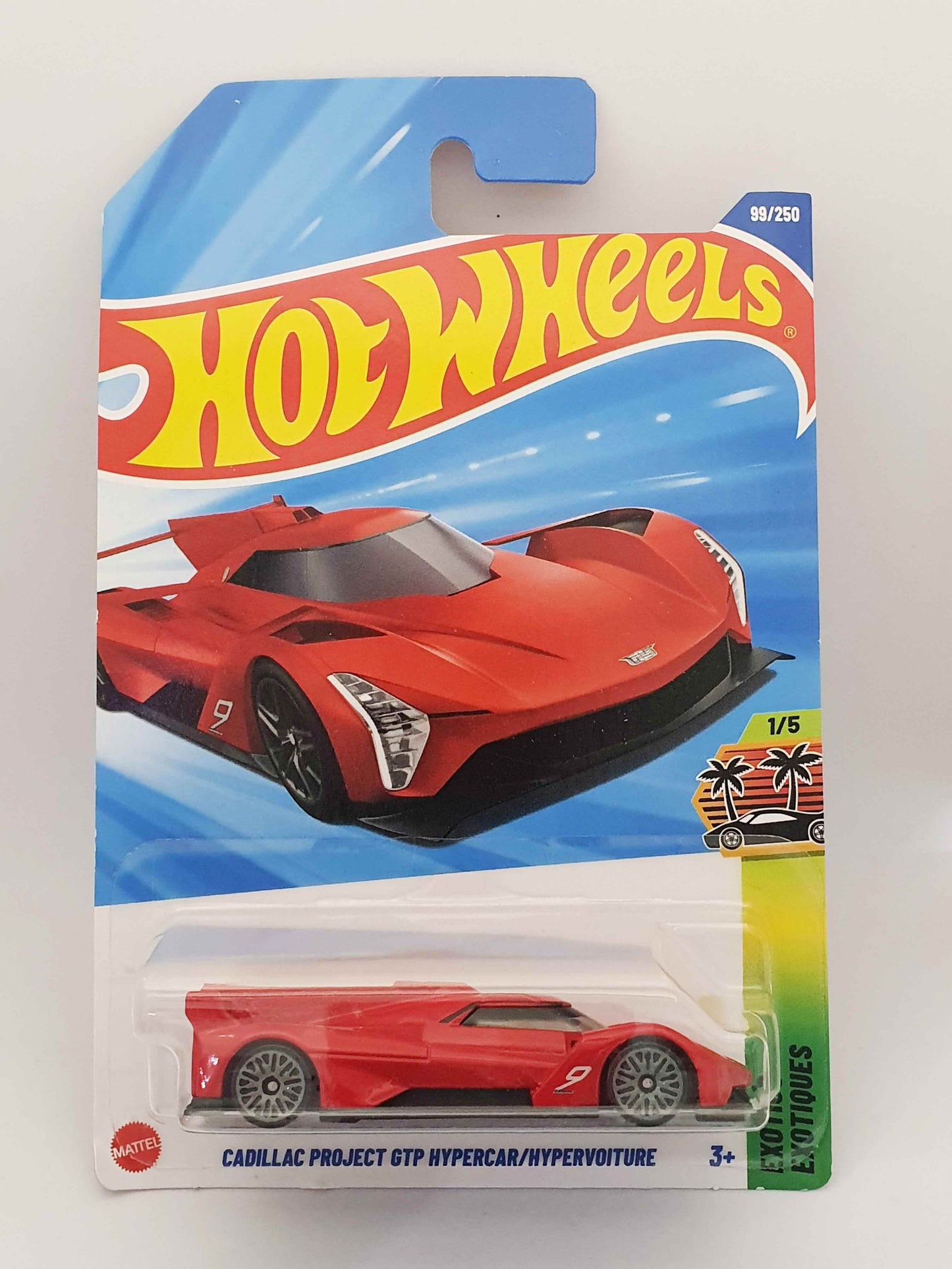 Hot Wheels toy car in packaging with red car and blue sky background