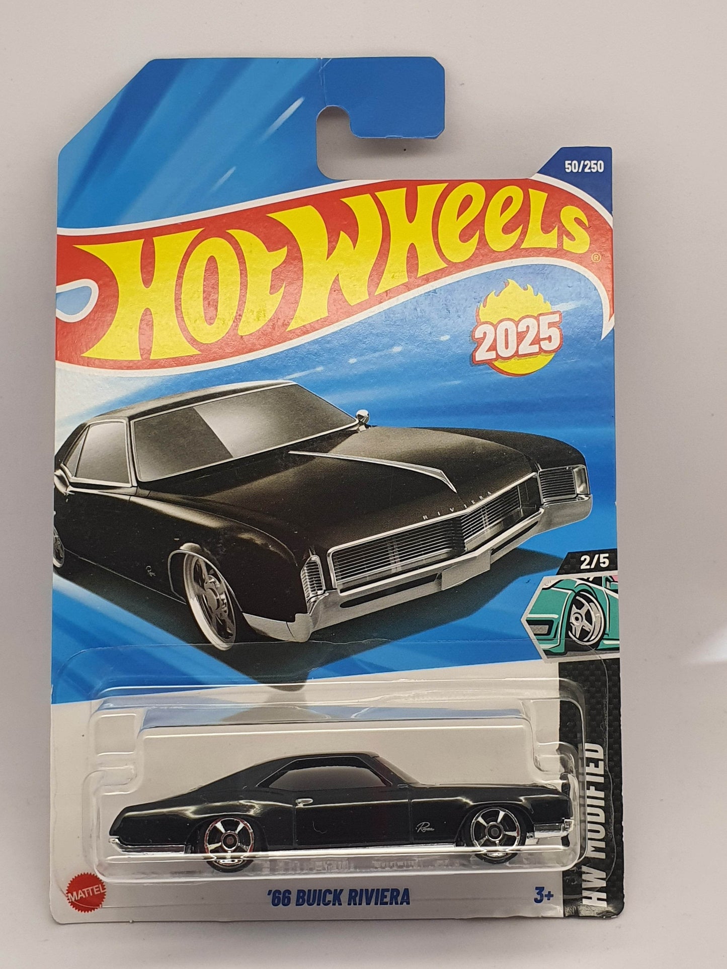 Hot Wheels toy car packaging with a black and silver car on a white background